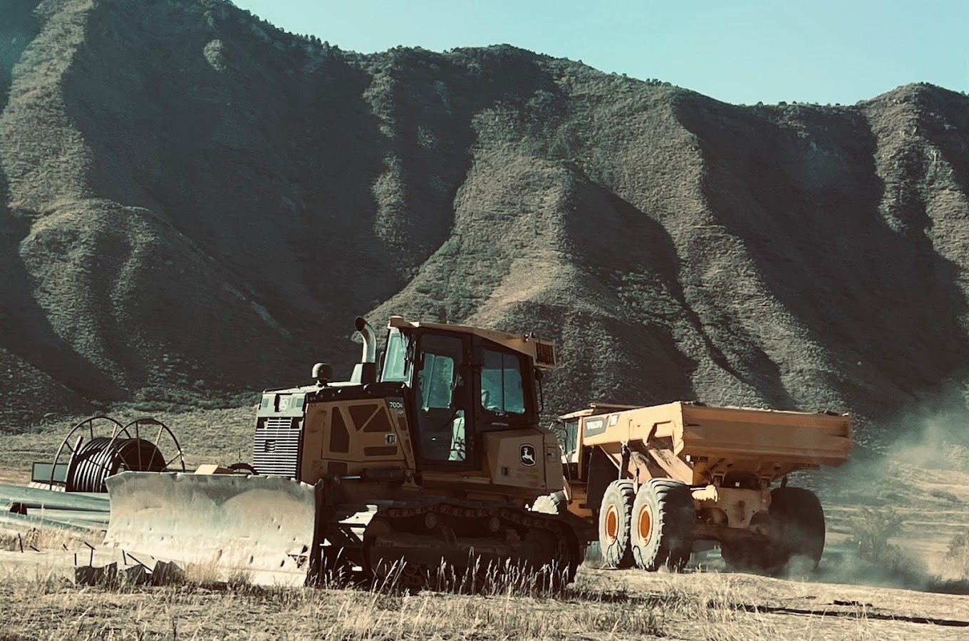 Bulldog Construction heavy equipment dozer on a commercial grading site in the Roaring Fork Valley.